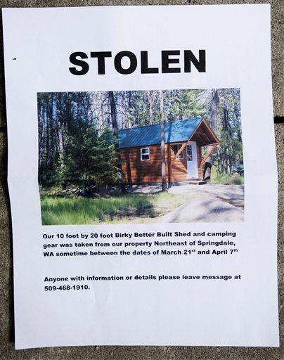 A notice sign for the Hempel's stolen cabin is displayed on Wednesday, April 8, 2015, near Springdale, Wash. 