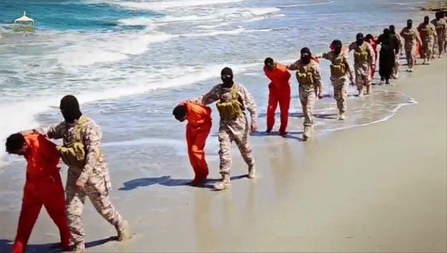 This undated image made from a video released by Islamic State militants, Sunday, April 19, 2015, appears to show the killing of a group of captured Ethiopian Christians in Libya. 