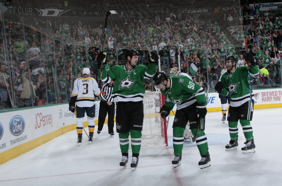 Jamie Benn #14, Jason Spezza #90 and Patrick Eaves #18 of the Dallas Stars celebrate a goal against the Nashville Predators at the American Airlines Center on April 11, 2015 in Dallas, Texas. 