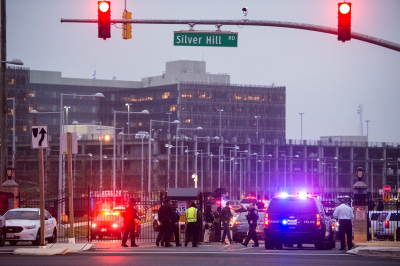Officers prepare to head toward the U.S. Census Bureau building after reports that a federal officer had been shot at the U.S. Census Bureau in Silver Hill, MD on Friday, April 9, 2015. 