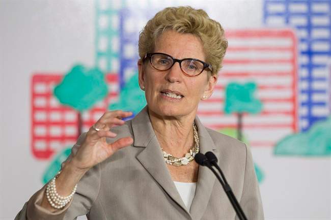 Ontario Premier Kathleen Wynne addresses the media during an announcement which outlined a cap and trade deal with Quebec aimed at curbing green house emissions, in Toronto on Monday, April 13 2015.