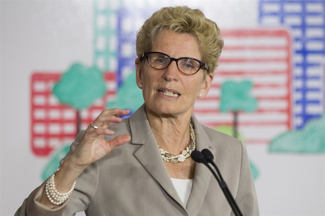 Ontario Premier Kathleen Wynne addresses the media during an announcement which outlined a cap and trade deal with Quebec aimed at curbing green house emissions, in Toronto on Monday, April 13 2015.