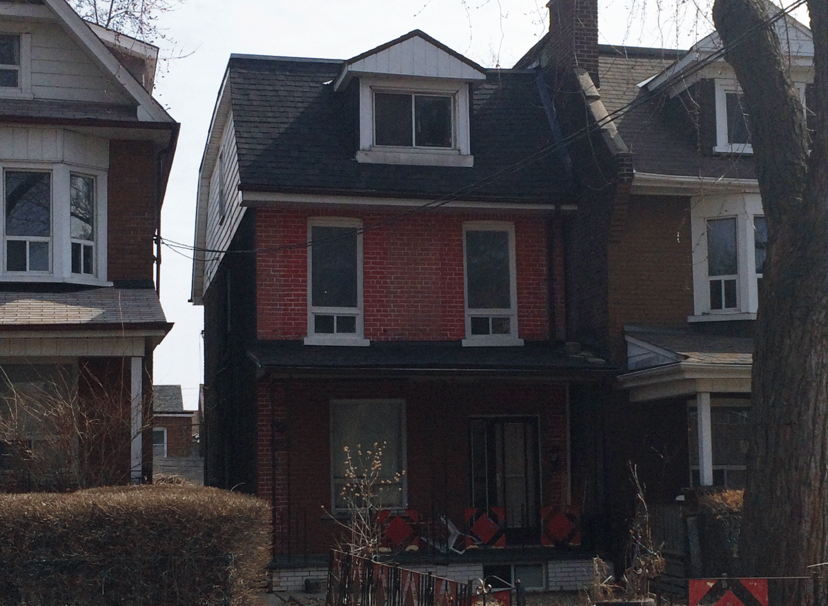 Police say the suspect, Rejean Hermel Perron, brought a woman to this Toronto home where he produced a firearm and held her captive.