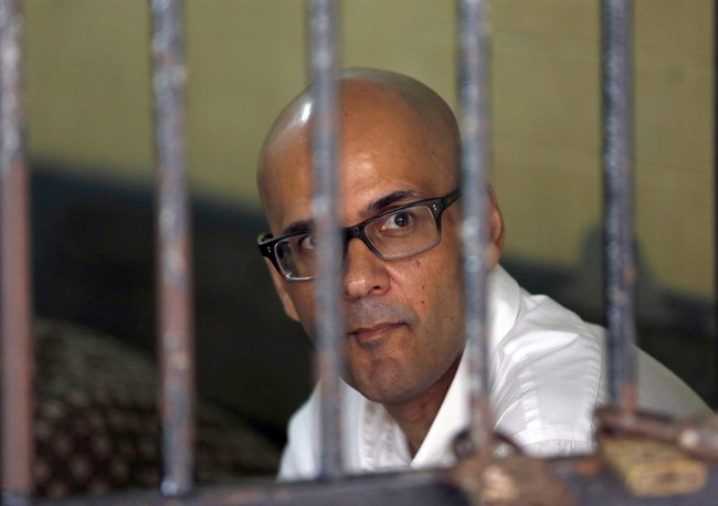 Canadian teacher Neil Bantleman sits inside a holding cell prior to the start of his trial hearing to listen to the prosecutor's demand at South Jakarta District Court in Jakarta, Indonesia, March 12, 2015.