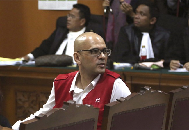 Canadian teacher Neil Bantleman reacts during his verdict trial at South Jakarta District Court in Jakarta, Indonesia, Thursday, April 2, 2015.