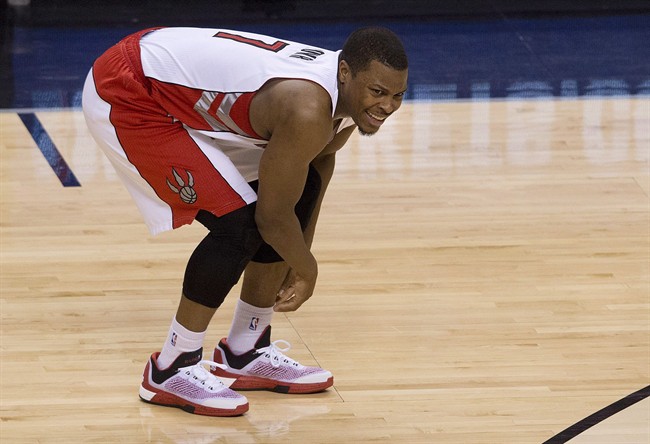 Toronto Raptors guard Kyle Lowry, reacts after being injured while playing during the second half NBA first round playoff basketball action in Toronto on April 21, 2015.
