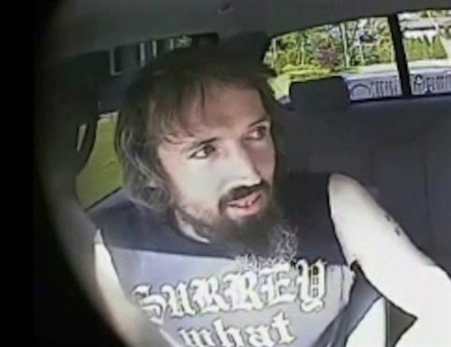 John Nuttall is shown in a still image taken from RCMP undercover video. A series of plans proposed by a British Columbia man on trial for plotting to blow up the provincial legislature was "hokey and harebrained," an undercover officer has told a Vancouver court. The officer, who cannot be identified, said in B.C. Supreme Court Thursday that John Nuttall's hands were shaking nervously as he tabled his ideas that included hijacking a nuclear submarine and firing rockets at a Vancouver Island military base. 