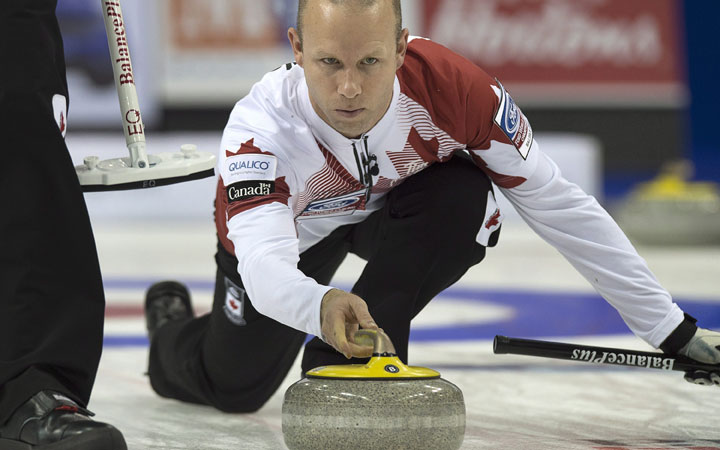 Team Canada skip Pat Simmons releases a rock in playoff action against Sweden at the men's world curling championships in Halifax on Saturday, April 4, 2015.