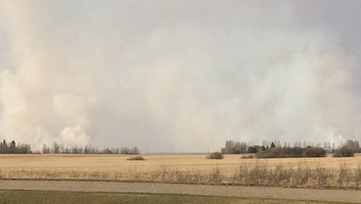 Six fire departments battle through the night to bring a grass fire near Borden, Sask. under control.