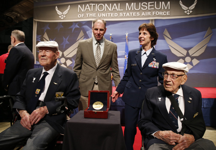 The two remaining members of the Doolittle Tokyo Raiders, Staff Sgt. David Thatcher, front left, and Lt. Col. Richard "Dick" Cole, right, pose for photos after the Congressional Gold Medal to the Doolittle Tokyo Raiders was presented to the National Museum of the United States Air Force.