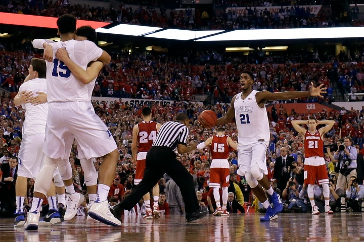 Jahlil Okafor scored two big buckets late and his freshman buddy Tyus Jones hit a key 3-pointer to lift Duke to its fifth national title Monday night in a 68-63 comeback win over Wisconsin.