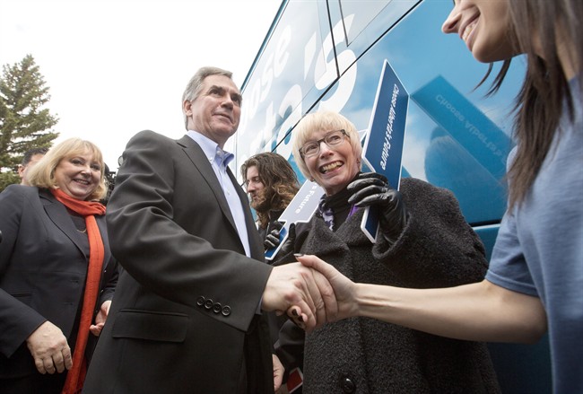 Alberta Premier Jim Prentice shakes the hands of supporters in Edmonton, on Tuesday April 7, 2015.