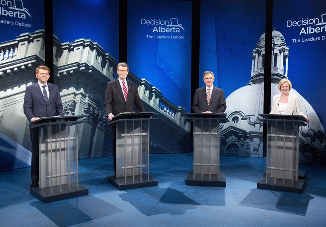 FILE – From left Wildrose Party leader Brian Jean, Liberal leader David Swann, Alberta Progressive Conservative leader Jim Prentice and NDP leader Rachel Notley stand for a photo op before leaders debate in Edmonton on Thursday, April 23, 2015.