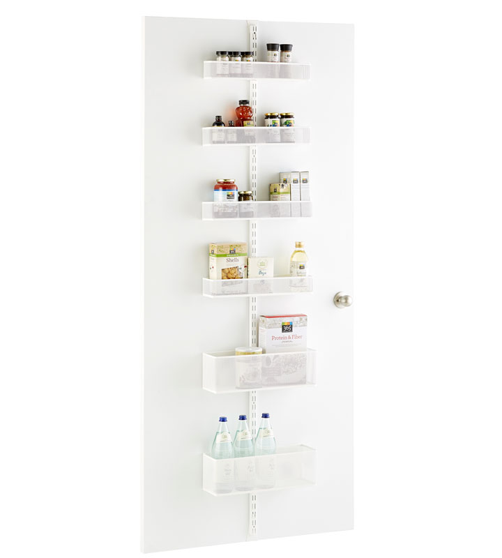 This photo provided by The Container Store shows a white Elfa utility Mesh Pantry Door & Wall Rack that is a great way to add extra storage in a small kitchen. It assembles without tools, and is also available in a platinum finish.