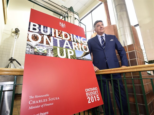 Ontario Finance Minister Charles Sousa, pictured, April 22, 2015, says the 2014 election created 'challenges' in cutting insurance rates.