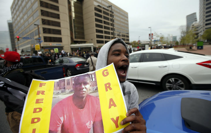 Marchers block the Pratt Street after a march to City Hall for Freddie Gray, Saturday, April 25, 2015 in Baltimore. Gray died from spinal injuries about a week after he was arrested and transported in a police van.