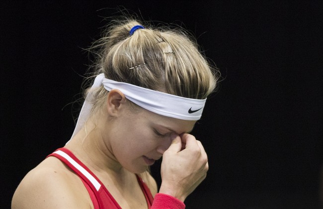 Canada's Eugenie Bouchard reacts during her Federal Cup tennis match against Romania's Alexandra Dulgheru in Montreal, Saturday, April 18, 2015. 