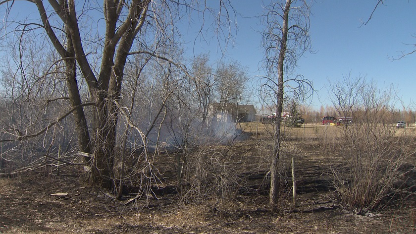Grass fire near Steinbach threatened homes Friday afternoon.