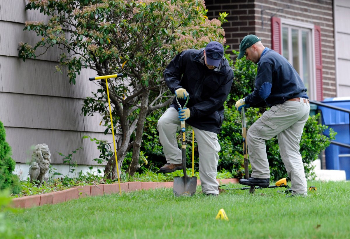  In this May 10, 2012 file photo, law enforcement agents dig in the front yard of the home of Robert Gentile in Manchester, Conn. 
