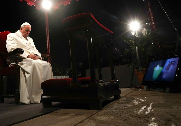 Pope Francis leads the “Via Crucis” (Way of the Cross) procession, which commemorates the crucifixion of Jesus Christ, at the Colosseum in Rome, Friday, April 3, 2015.