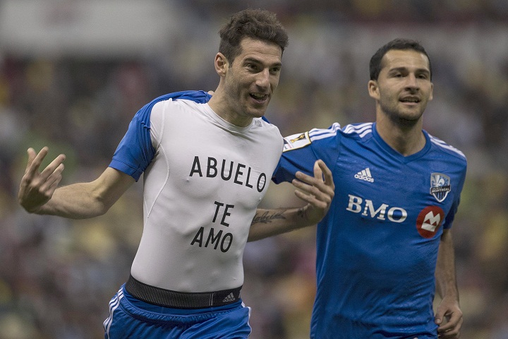 Ignacio Piatti of Canada’s Montreal Impact, left, celebrates scoring a goal against Mexico’s America by showing his undershirt with the message that reads in Spanish “Grandfather I love you” as teammate Dilly Duka, right, runs behind him during a CONCACAF Champions league match in Mexico City, Wednesday, April 22, 2015.