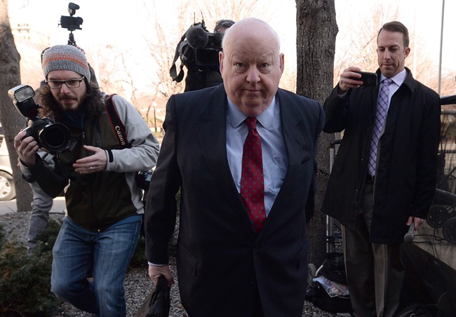 Suspended senator Mike Duffy arrives at the courthouse for his trial in Ottawa on Thursday, April 16, 2015. THE CANADIAN PRESS/Sean Kilpatrick.