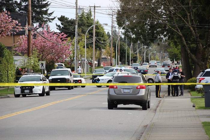 Police investigate a shooting in the 7000 block of 130th Street on April 12, 2015. 