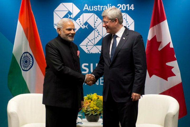 Canadian Prime Minister Stephen Harper shakes hands with Indian Prime Minister Narendra Modi before a bi-lateral meeting at the G20 Summit in Brisbane, Australia Saturday November 15, 2014.