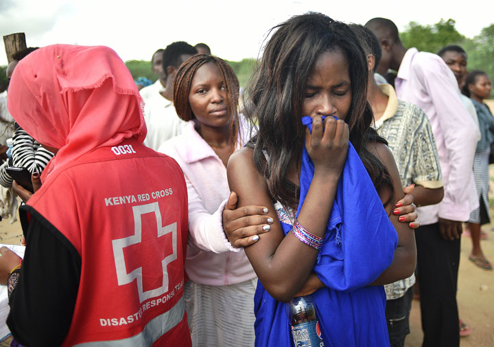 Students evacuated from Moi University during a terrorist siege react as they gather together in Garissa on April 3, 2015 before being transported to their home regions. 