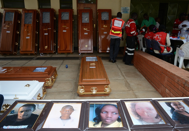 Portraits of the slain Garissa University students are displayed outside the Chiromo morgue, on April 9, 2015 in Nairobi.