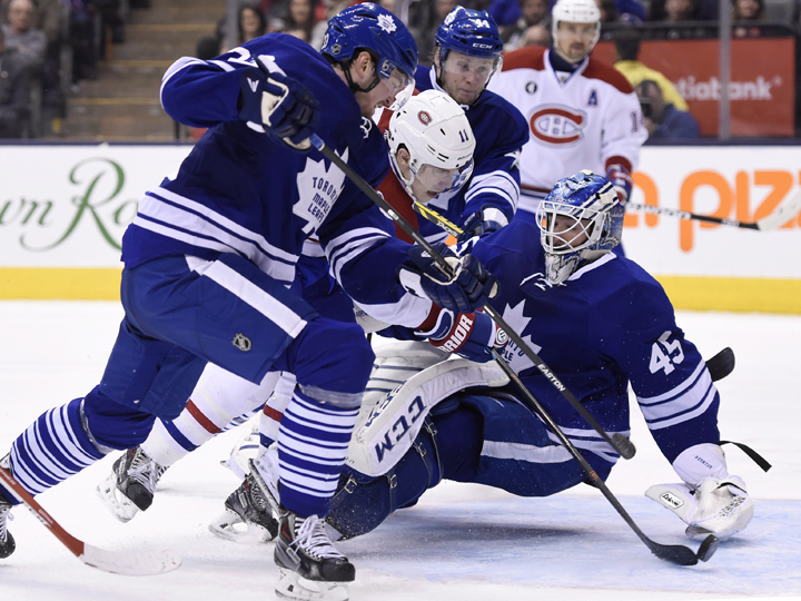 Montreal Canadiens' Brendan Gallagher scores on Toronto Maple Leafs goalie Jonathan Bernier during third period NHL action in Toronto on Saturday, April 11, 2015.
