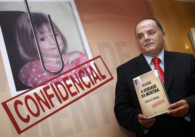 In this Thursday, July 24 2008 file photo, former detective Goncalo Amaral poses with his book "The Truth in the Lies" during its launch in Lisbon.