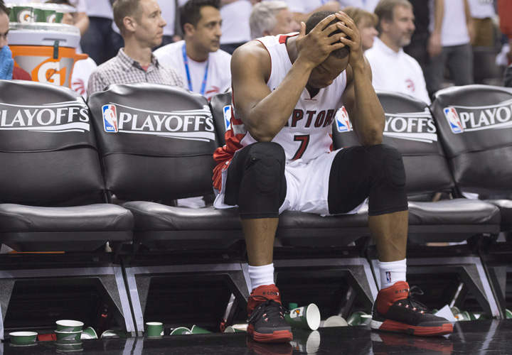 Toronto Raptors' Kyle Lowry sits on the bench after fouling out of the game during fourth quarter NBA playoff action against the Washington Wizards in Toronto on Saturday, April 18, 2015.