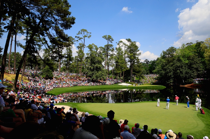 Patrons watch the play during the Par 3 Contest prior to the start of the 2015 Masters Tournament at Augusta National Golf Club on April 8, 2015 in Augusta, Georgia. 