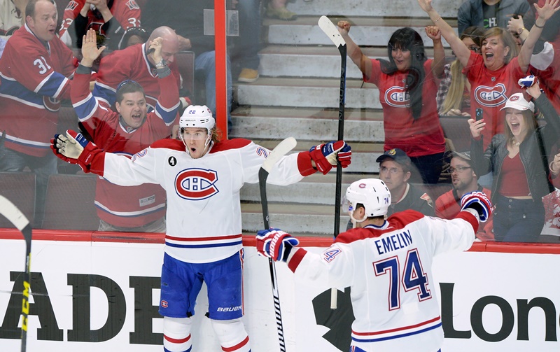 Montreal Canadiens forward Dale Weise (22) celebrates his goal against the Ottawa Senators with teammate Alexei Emelin (74) during the third period of game 3 of first round Stanley Cup NHL playoff hockey action in Ottawa on Sunday, April 19, 2015. 