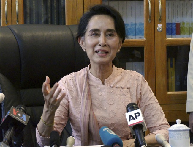 Myanmar opposition leader Aung San Suu Kyi speaks to journalists during a press conference at a parliament building Thursday, April 9, 2015 in Naypyitaw, Myanmar. 