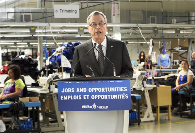 Finance Minister Joe Oliver speaks to the media at the Canada Goose factory while announcing the date of the federal budget in Toronto on Thursday, April 2, 2015. 