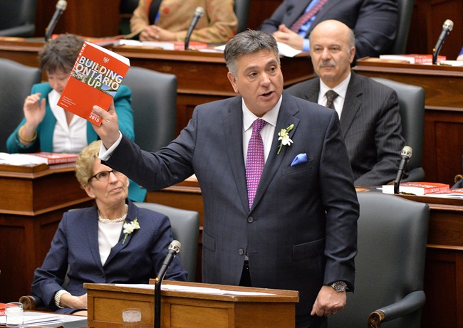 Ontario Finance Minister Charles Sousa delivers the provincial budget as Premier Kathleen Wynne looks on at Queen's Park in Toronto on Thursday, April 23, 2015. THE CANADIAN PRESS/Nathan Denette.