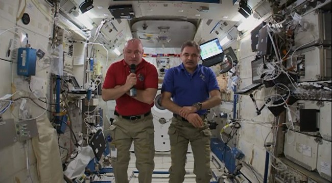 This video screen grab taken from NASA, American astronaut Scott Kelly and Russian cosmonaut Mikhail Kornienko are interviewed at International Space Station on Wednesday, April 29, 2015. 