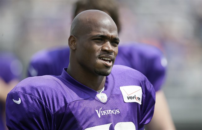 This July 31, 2014 file photo shows Minnesota Vikings running back Adrian Peterson during NFL football training camp in Mankato, Minn. 