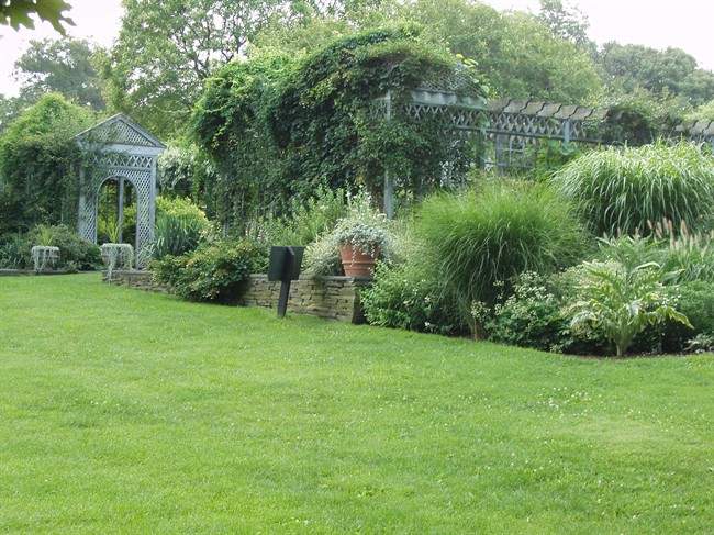 This undated photo shows a section of the white garden at the Snug Harbor Cultural Center & Botanical Garden in Staten Island, N.Y. The garden has many white-flowering varieties of plants, shrubs and trees. The color scheme was inspired by a famous white garden at Sissinghurst Castle in Kent, England, a historic National Trust site.