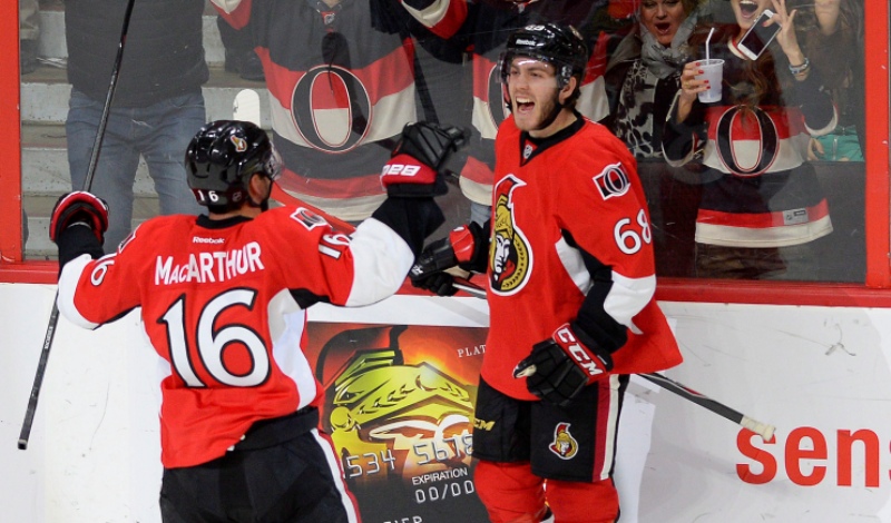Ottawa Senators' Mike Hoffman (68) celebrates after scoring a goal and tying the game with teammate Clarke MacArthur (16) against the Pittsburgh Penguins during third period NHL action in Ottawa on Tuesday April 7, 2015. THE CANADIAN PRESS/Justin Tang.