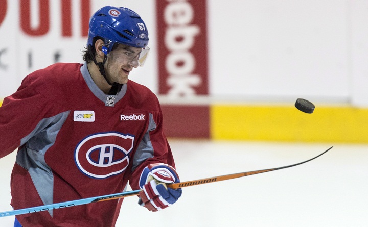 Montreal Canadiens' Max Pacioretty juggles a puck with his stick during a practice, Monday, April 13, 2015 in Brossard, Que.