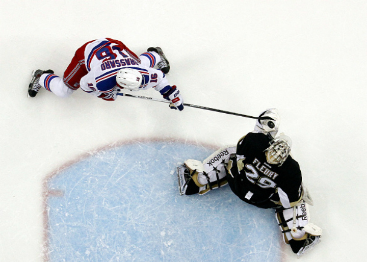 :PITTSBURGH, PA - APRIL 20: Marc-Andre Fleury #29 of the Pittsburgh Penguins makes a save on Derick Brassard #16 of the New York Rangers in Game Three of the Eastern Conference Quarterfinals during the 2015 NHL Stanley Cup Playoffs at Consol Energy Center on April 20, 2015 in Pittsburgh, Pennsylvania.