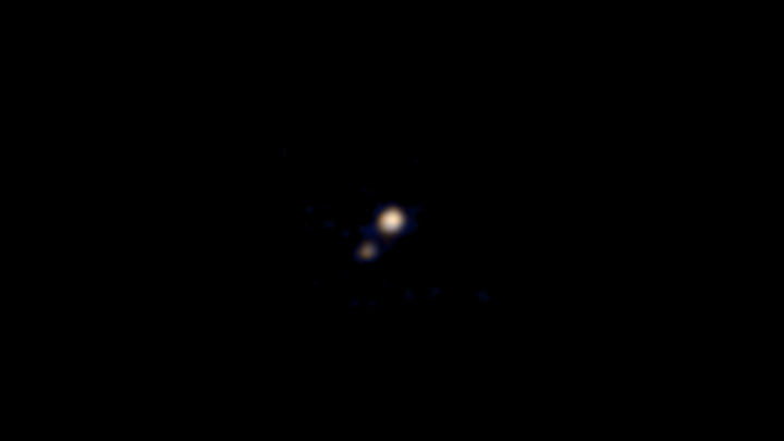The first colour image of Pluto and its largest moon Charon, obtained from NASA’s New Horizons spacecraft.
