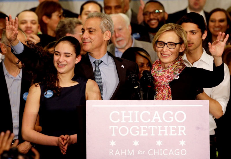 Chicago Mayor Rahm Emanuel and his wife, Amy Rule, celebrate a victorious election night at Plumbers Local 130 Union Hall, Tuesday, April 7, 2015, in Chicago. 