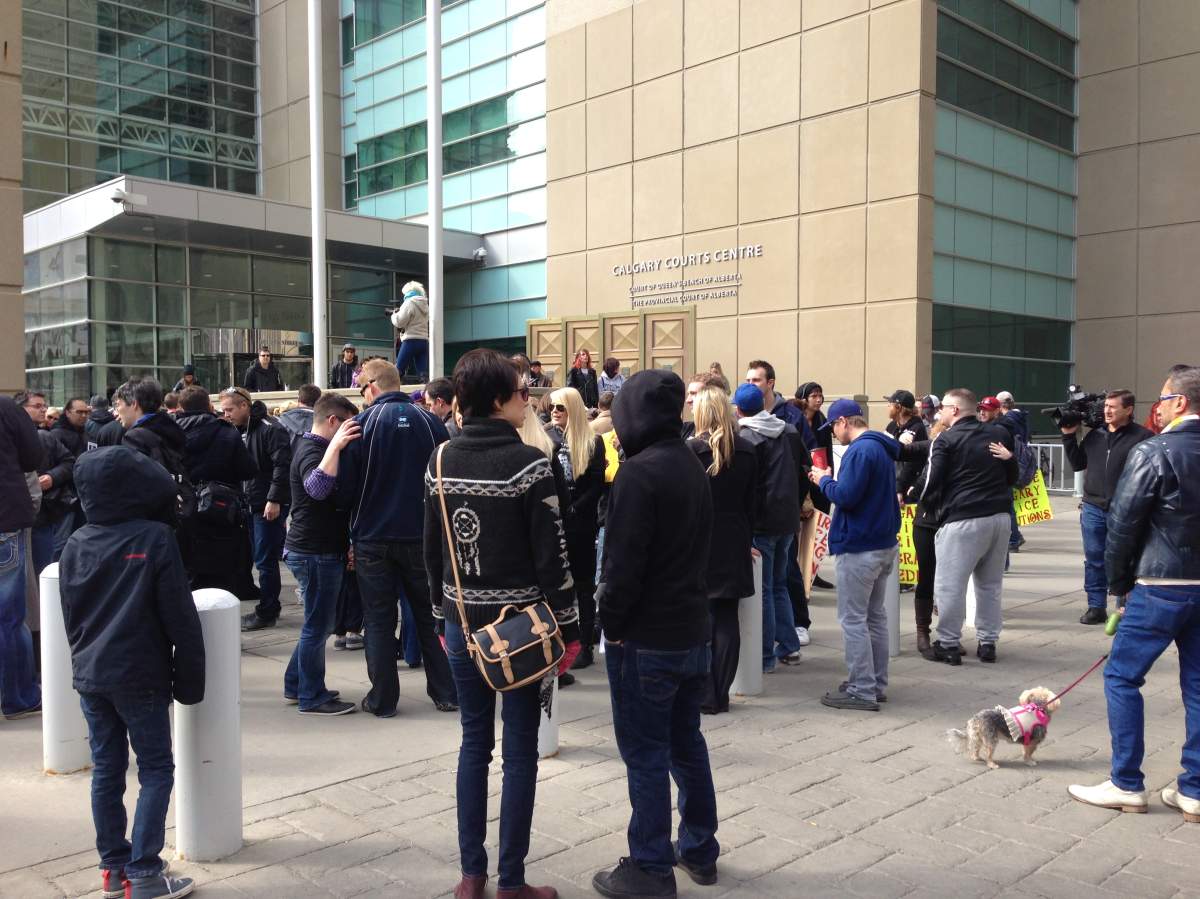 Around 100 people gathered at a rally at the Calgary Courts Center Saturday, to protest police shooting of Anthony Heffernan.