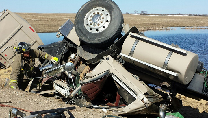A man is dead after the truck he was hauling grain with rolled on a grid road in central Saskatchewan.
