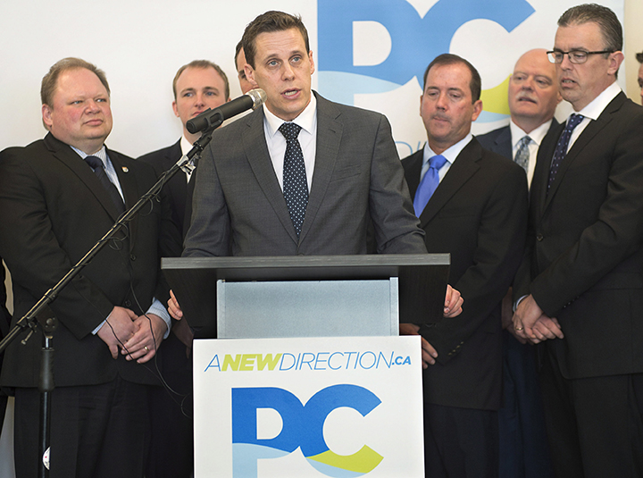 Prince Edward Island Progressive Conservative leader Rob Lantz, surrounded by candidates, announces the start of their election campaign in Cornwall, P.E.I., on Tuesday, April 7, 2015.