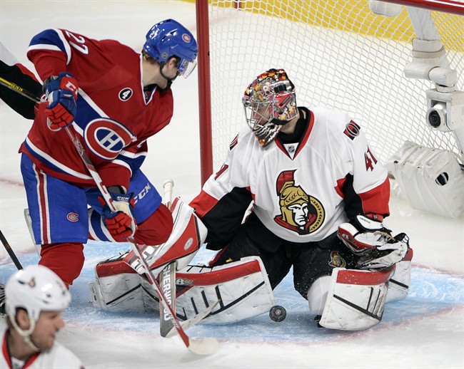 Ottawa Senators goalie Craig Anderson (41) stops Montreal Canadiens center Alex Galchenyuk (27) during second period of Game 5 NHL first round playoff hockey action Friday, April 24, 2015 in Montreal.